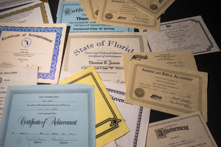 Diplomas belonging to Thomas Raynard James earned while in prison layoff a table at his home in Miami, Florida United States, June 24, 2022.