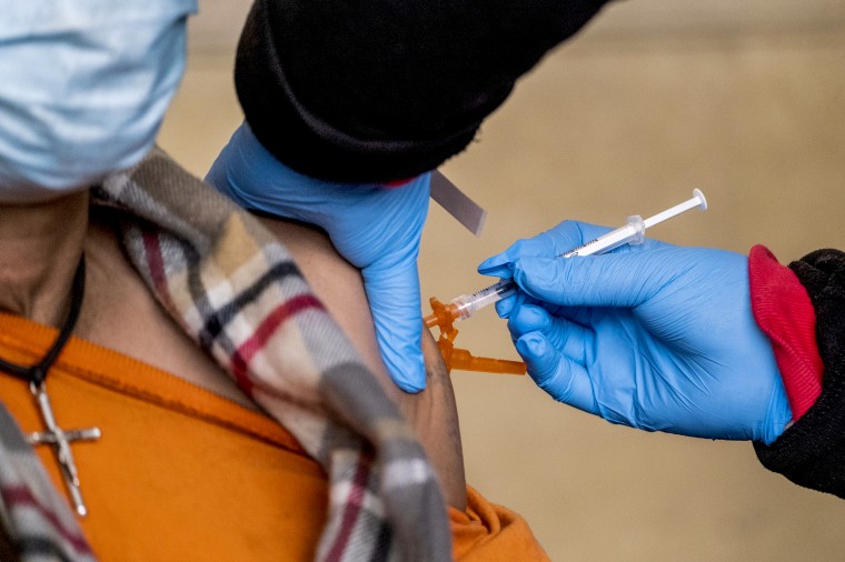 A health worker administers a Covid-19 vaccination in Los Angeles on Jan 7, 2022.