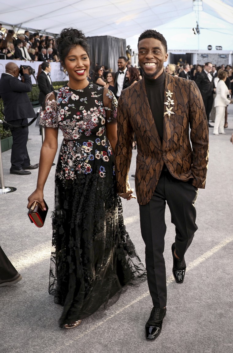 Chadwick Boseman, right, and Taylor Simone Ledward arrive at the 25th annual Screen Actors Guild Awards in Los Angeles on Jan. 27, 2019.