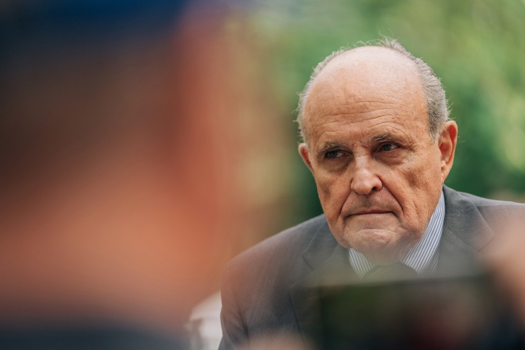 Former New York City Mayor Rudy Giuliani speaks to reporters during a joint campaign appearance with his son in Manhattan, June 7, 2022. (Jeenah Moon/The New York)