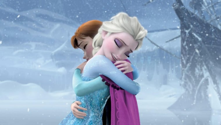 Frozen, 2013. Elsa in blue voiced by Idina Menzel meets her sister Anna voiced by Kristen Bell.