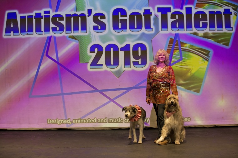 Kratu presses into Tess Eagle Swan to help calm her at Autism’s Got Talent.
