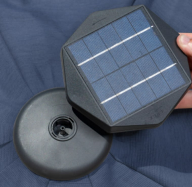 The solar panel puck, which contains the battery, located at the top of the umbrella.