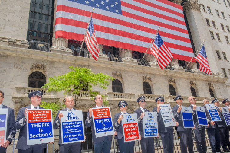 Demonstrators during an Allied Pilots Association and Transport Workers Union protest outside the New York Stock Exchange in New York, US, on June 2. The APA, representing the 14,000 pilots of American Airlines, and other workers from the airline held an informal picket to emphasize the need for reforms at the company. 
