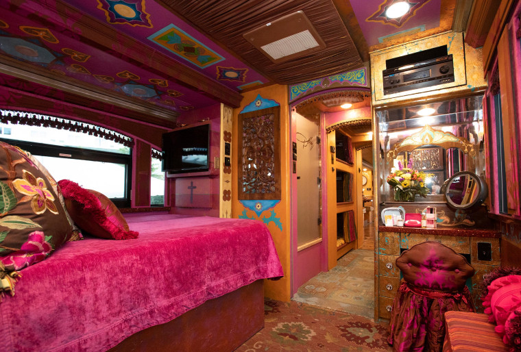 The bedroom features brightly-colored accents and some personal memorabilia from Parton herself.
