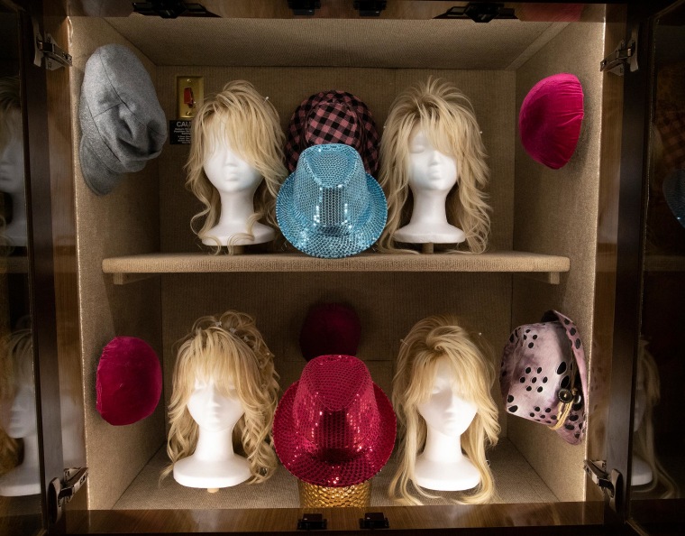 Parton's trademark wigs are on display for guests.