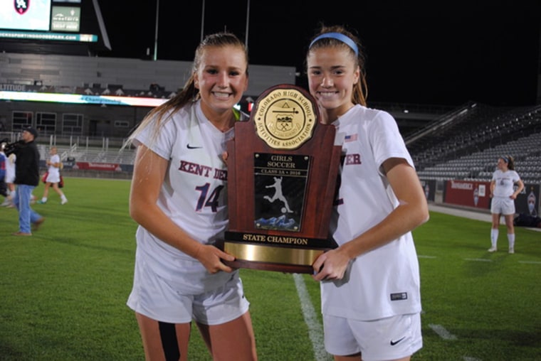 Maddie, right, and her sister Emma win a state soccer championship.