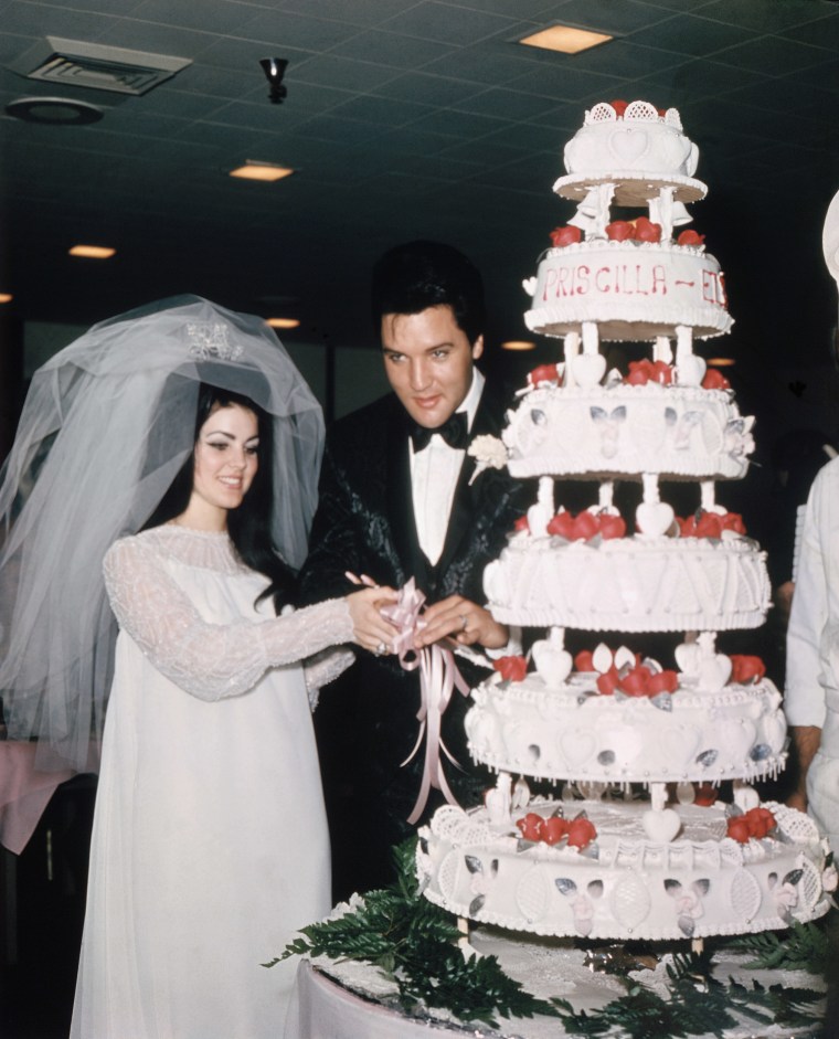 Elvis Presley cuts wedding cake with bride Priscilla Presley in May 1, 1967, in Las Vegas.