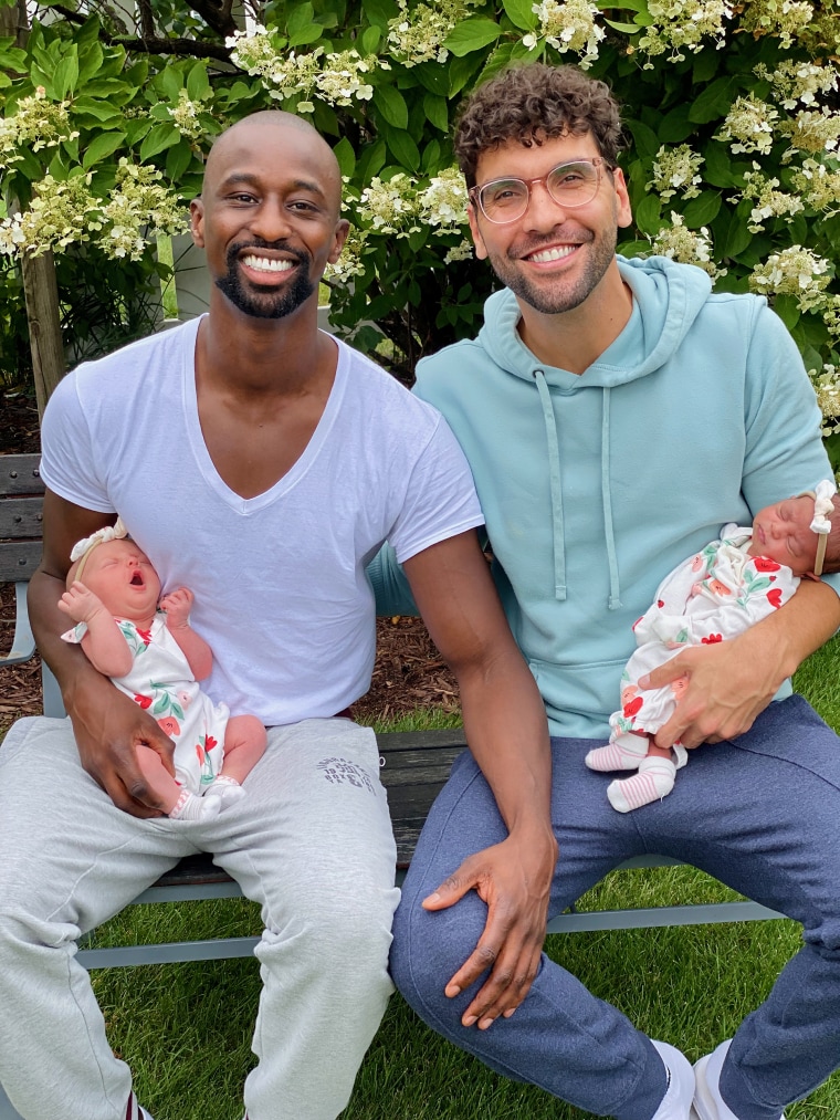 Amadou “Tee” Lam and Adam Motz are pictured with their daughters, Reve Christine and Sky Khoudia.