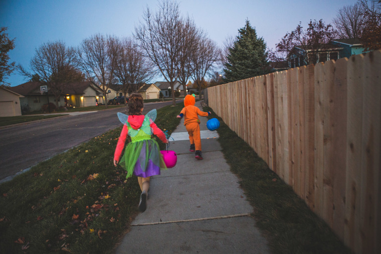 Little boy and Little girl trick or treating