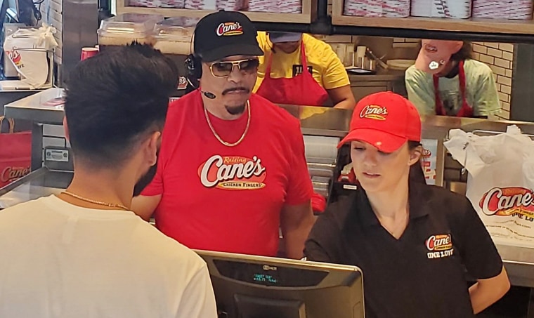 Ice-T ringing customers up at a Raising Cane's location in Phoenix, Arizona. 