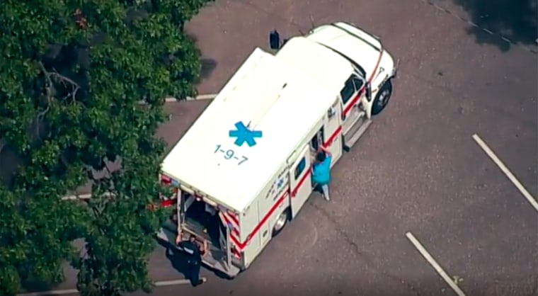 An ambulance responds after the slide flipped over.