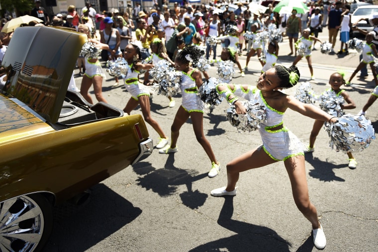 Anaja Campbell (far right) and the Denver Dancing Diamonds preform at 27th in Historic Five Points during the Juneteenth Celebration parade that started at Manual High School commemorating the ending of slavery in the United States. June 20, 2015 Denver, CO (