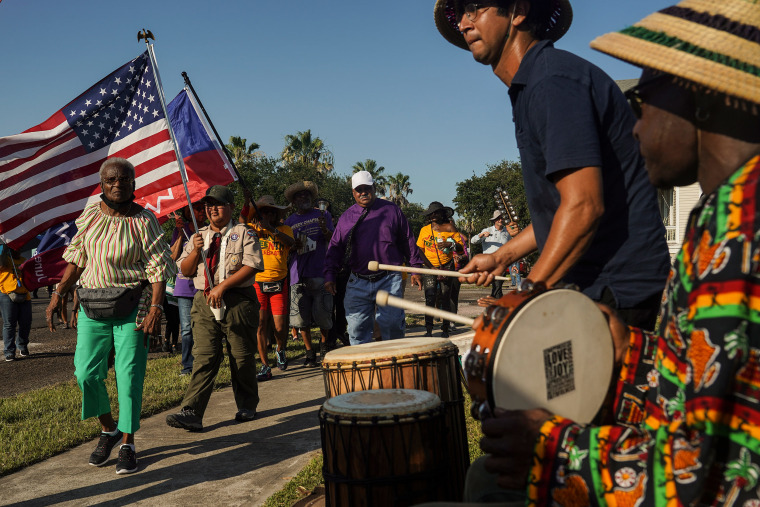 Members of Reedy Chapel African Methodist Episcopal Church march to celebrate Juneteenth on June 19, 2021 in Galveston, Texas.
