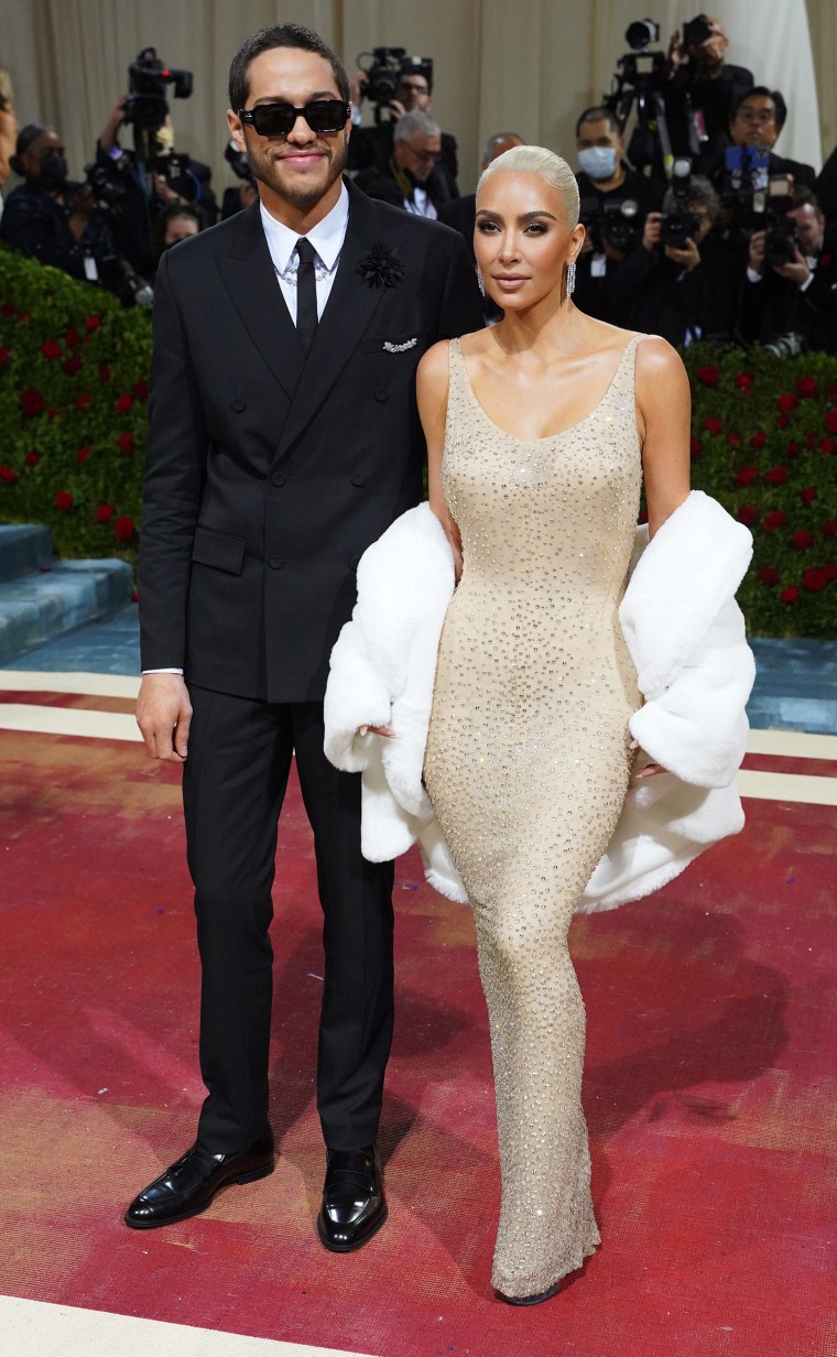 Kim Kardashian, with boyfriend Pete Davidson, is seen wearing Marilyn Monroe's famous "Happy Birthday" dress at the 2022 Met Gala. 