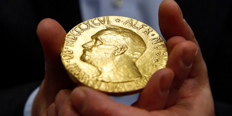 A bidder holds the 1936 Nobel Peace Prize — the second Nobel Peace Prize ever to come to auction. A Nobel Prize won last October by Russian journalist Dmitri Muratov shattered the record by selling for $103.5 million when it was auctioned off to help children displaced by the war in Ukraine. 