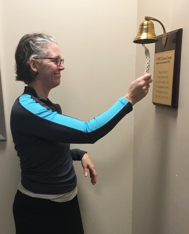 Brown rings a bell to mark the end of her radiation treatment.