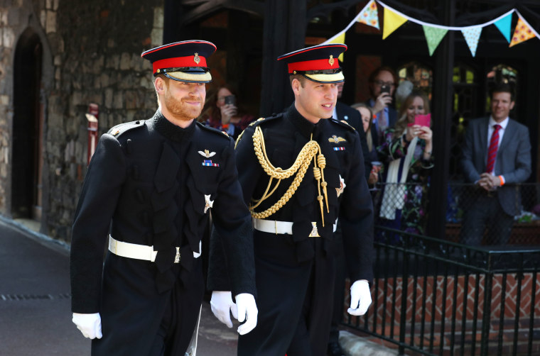 Prince Harry walks with his best man, Prince William