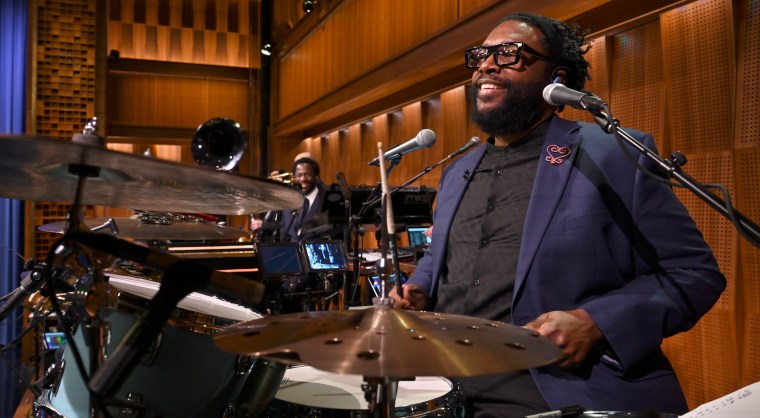 Questlove performing on The Tonight Show Starring Jimmy Fallon with his band "The Roots."