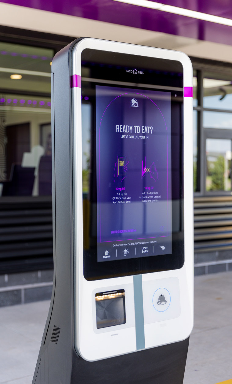 The new Taco Bell location will provide digital check-in screens for mobile order customers with unique QR codes. 