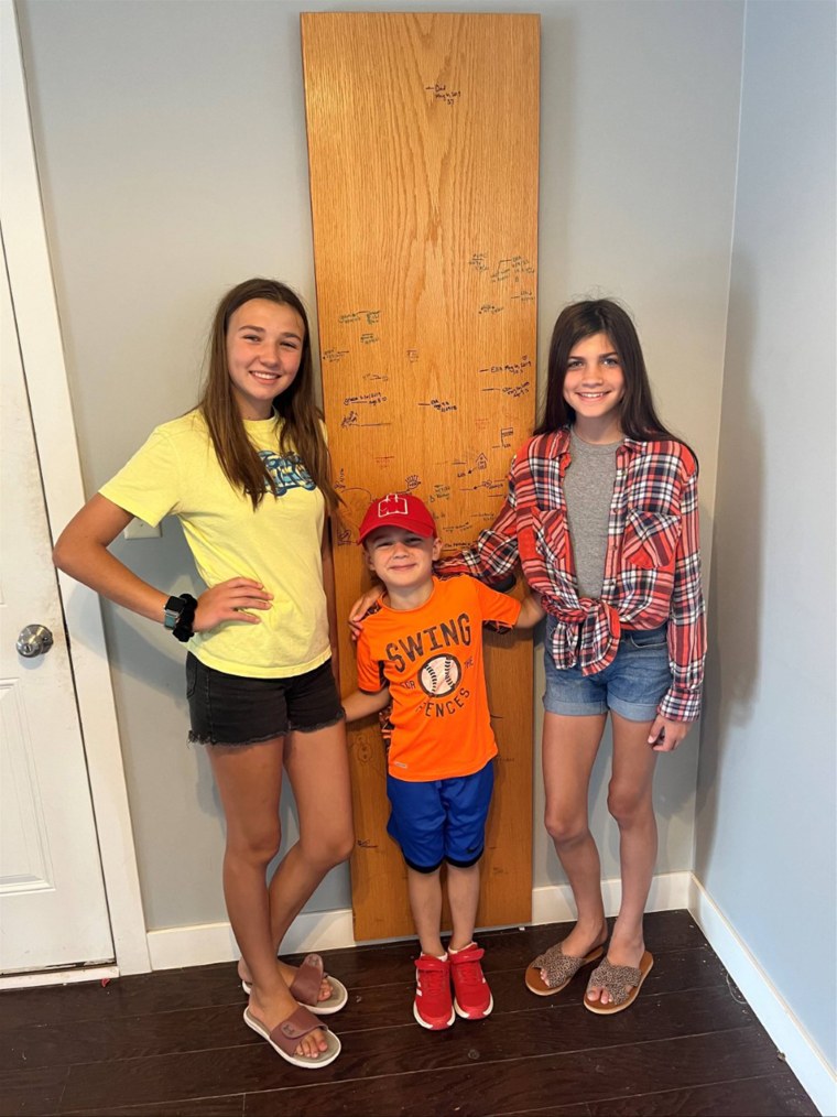 Leslie Means has chronicled her children's heights on the door. She started when her daughters were 4 and 2 and they are now 14 and 12.