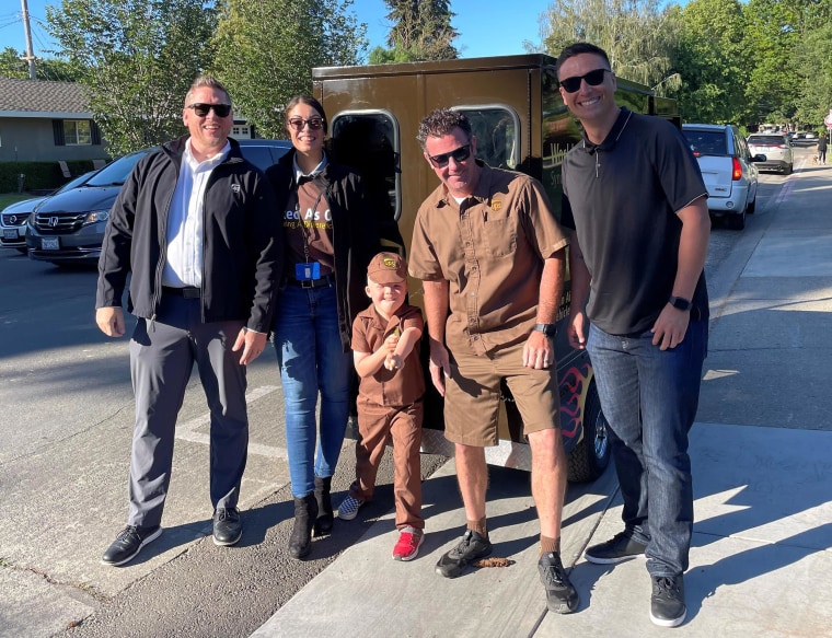 Drew Bausman, center, loved everything about his big day as a UPS driver.