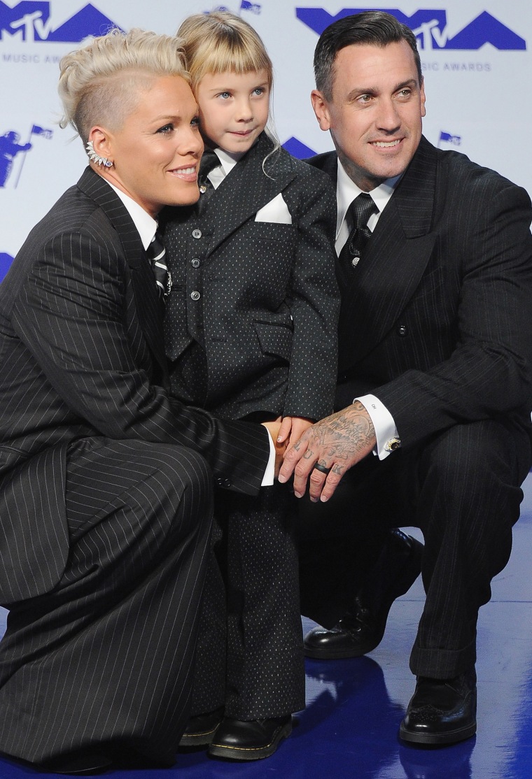 Eleven-year-old Willow (center) alongside her parents Pink and Carey Hart. 