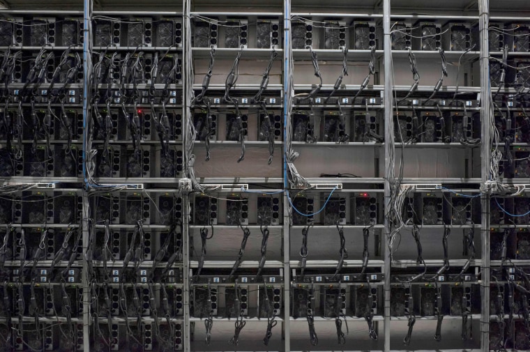 A row of Bitcoin mining machines at the Riot Blockchain facility in Rockdale, Texas.