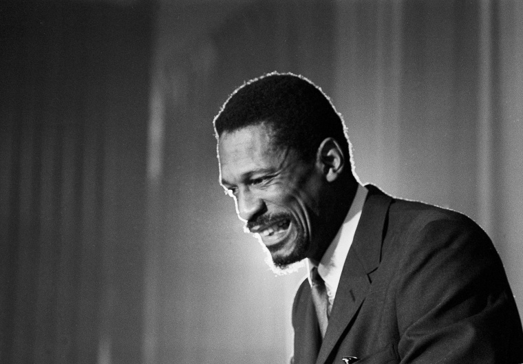 Bill Russell grins at announcement that he had been named coach of the Boston Celtics on April 18, 1966.