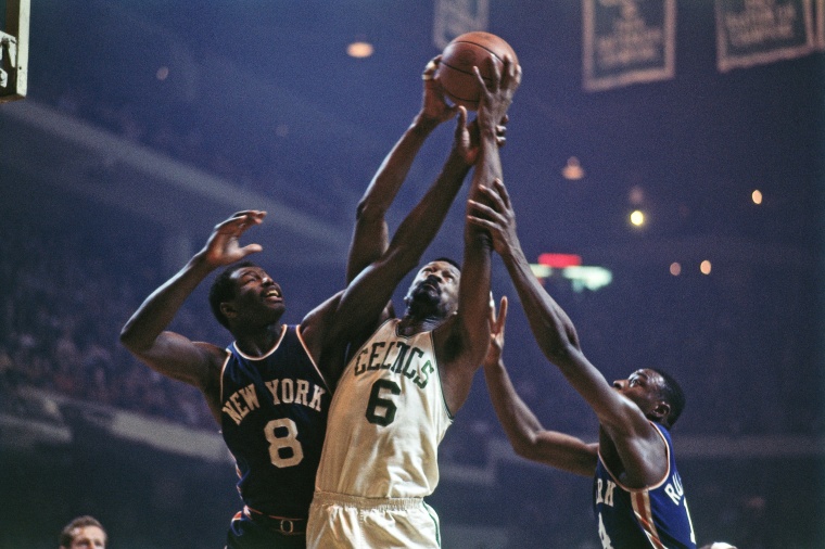 Bill Russell #6 of the Boston Celtics rebounds against Walt Bellamy #8 of the New York Knicks during a game in1967 at the Boston Garden.