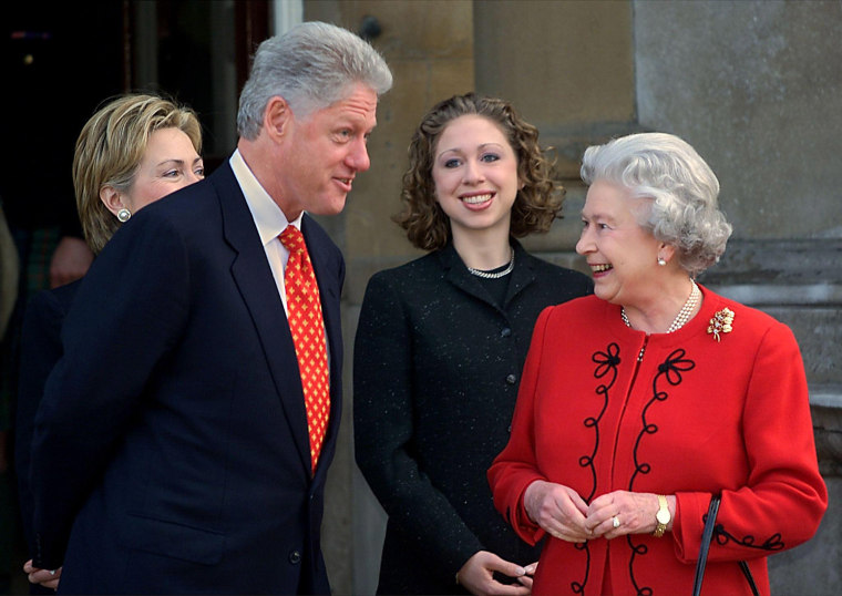 President Bill Clinton talks with Queen Elizabeth II along with the first lady Hillary Clinton and their daughter, Chelsea, at Buckingham Palace on Dec. 14, 2000.
