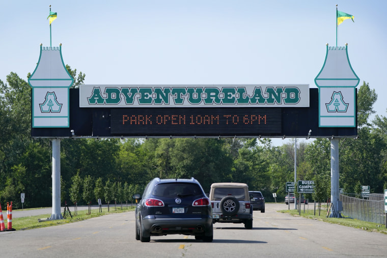 Visitors arrive at the Adventureland Park amusement park in Altoona, Iowa, on July 6, 2021.