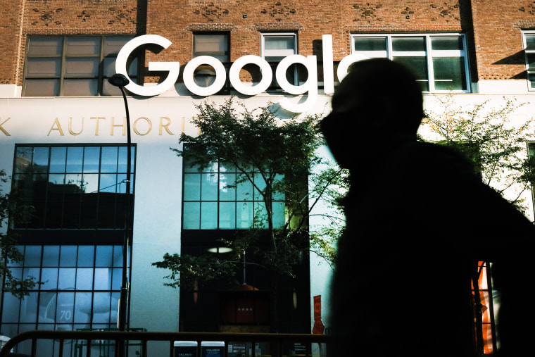 A person walks past Google's offices in New York