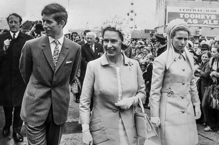 Queen Elizabeth II with the Princess Royal and the Prince of Wales as they passed through the crowds at the Royal Easter Show in Sydney during the Royal Tour of Australasia on April 3, 1970.