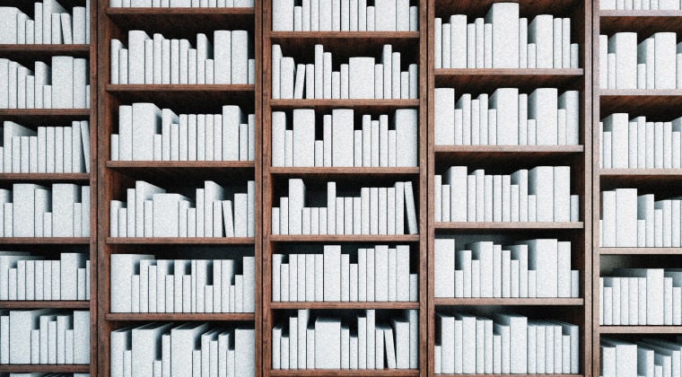 Image: White books stacked on bookshelves.