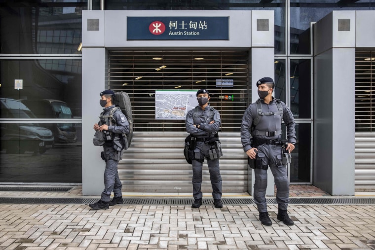 Police guard near West Kowloon Station in Hong Kong on June 30, 2022, ahead of Chinese President Xi Jinping's arrival to celebrate the 25th anniversary of the handover of Hong Kong from Britain to China.