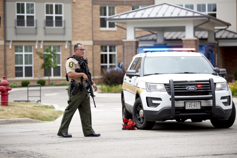 First responders work the scene of a shooting at a Fourth of July parade in Highland Park, Ill.