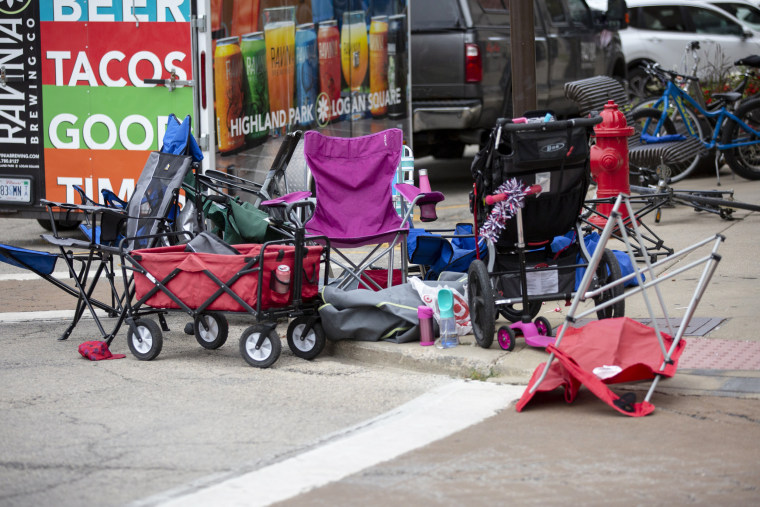 Seats used by parade watchers are left abandoned at the scene after a mass shooting at a Fourth of July parade