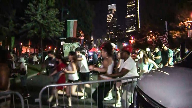 Various people could be seen running from near the Benjamin Franklin Parkway after reports of two officers reportedly being shot in Philadelphia on July 4, 2022.