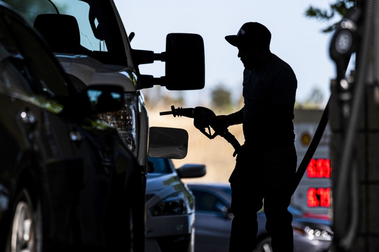 A customer holds a fuel nozzle at a Shell gas station in Hercules, Calif., on June 22, 2022.