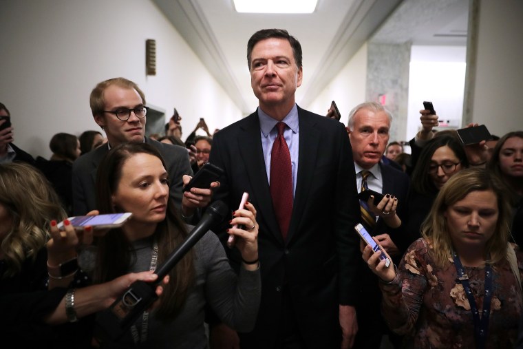 Image: Former FBI Director James Comey is surrounded by reporters after testifying to the House Judiciary and Oversight and Government Reform committees on Capitol Hill in 2018.