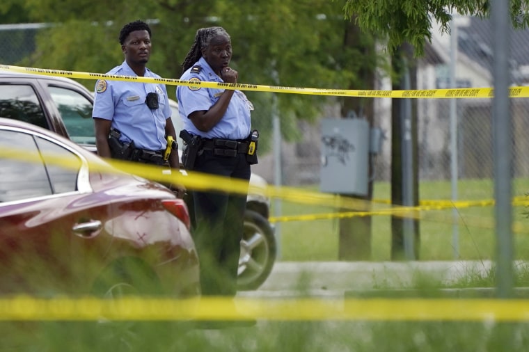 Investigators search the scene of a shooting at Xavier University in New Orleans on May 31.  