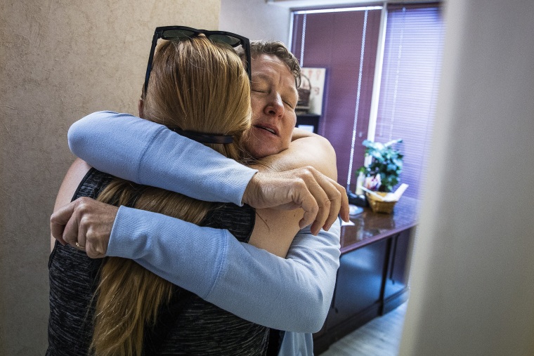 Image: Dr. Cheryl Hamlin hugs Kim Gibson, co-founder of The Pink House Defenders and clinic escort, before heading back home to Massachusetts at the Jackson Women's Health Organization clinic in Jackson, Miss., on June 7, 2022.