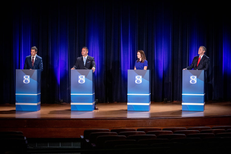 Michigan's Republican candidates for governor Ryan Kelley, left, Garrett Soldano, Tudor Dixon and Kevin Rinke during a debate on  July 6, 2022 in Grand Rapids, Mich.