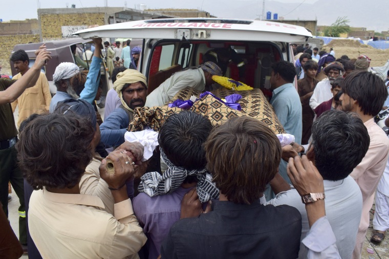 Image: People carry the body of a man who died when the roof of his house collapsed due to heavy rains, during his funeral on the outskirts of Quetta, Pakistan, on July 5, 2022.