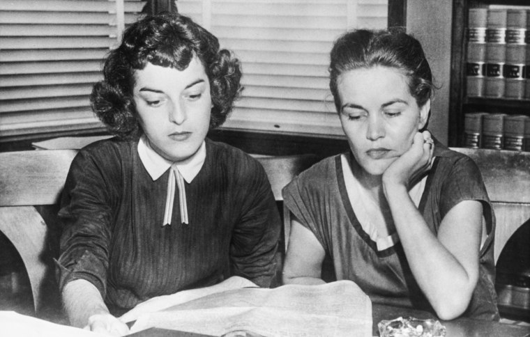 Carolyn Bryant, left, and Juanita Milam, the wives of Roy Bryant and John William Milam, who stand accused of the kidnap and murder of Emmett Till, sit in their husbands' lawyer’s office across the street from the courthouse in Sumner, Miss., on Sept. 30, 1955. Bryant and Milam were later acquitted.