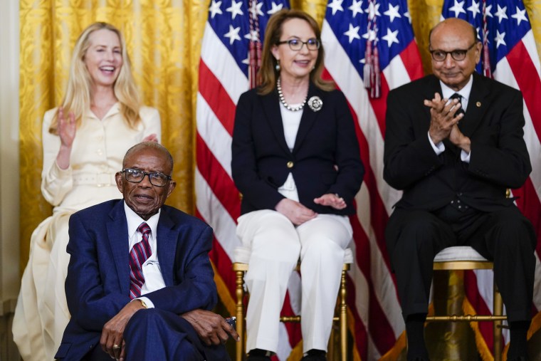 Fred Gray, bottom left, is recognized by President Joe Biden during a ceremony to award the nation's highest civilian honor, the Presidential Medal of Freedom, in the East Room of the White House on July 7, 2022.