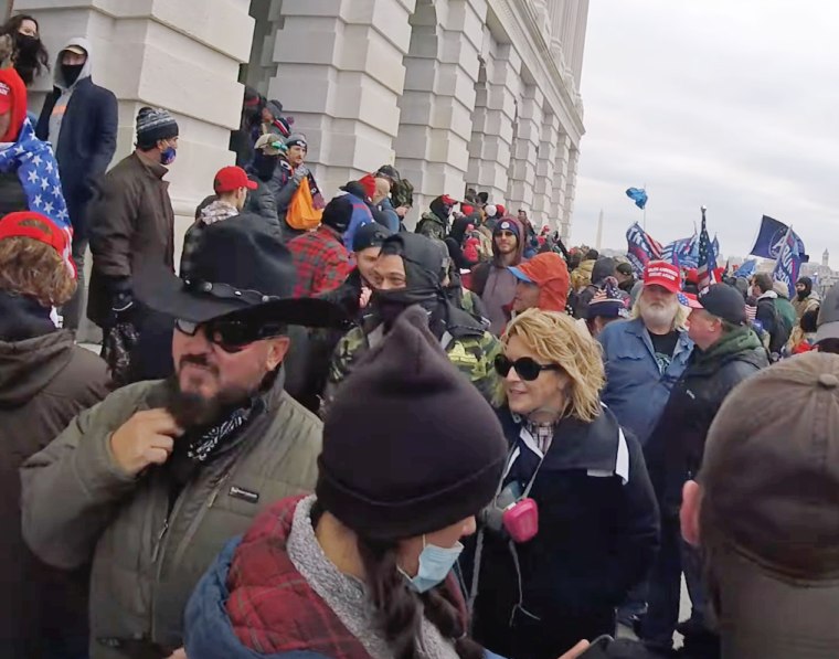 Stewart Rhodes, founder of the Oath Keepers, left, and Kellye SoRelle, in sunglasses, at the Capitol on Jan. 6, 2021.