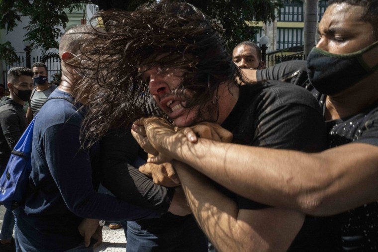 Image: plainclothes police detain an anti-government protester during a demonstration over high prices, food shortages and power outages, while some people also called for a change in the government, in Havana on July 11, 2021.