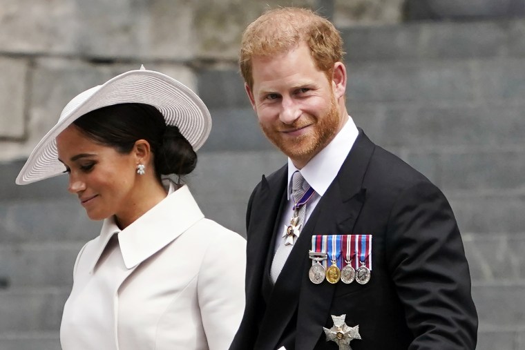 Prince Harry and his wife Meghan, Duchess of Sussex, depart a service of thanksgiving at St Paul's Cathedral in London, June 3, 2022.